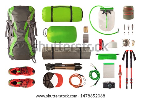 Top view of sport equipment and gear for trekking and camping. Collection of cookware, sleeping bag, travel accessories, etc. isolated on white background Royalty-Free Stock Photo #1478652068