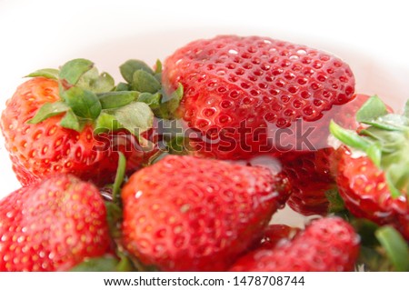 Beautiful Strawberries in water. Freshness of summer. Fruits. Fruit freshness.