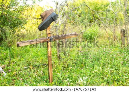 The grave of an unknown person from whom the boot had come off. Strange cross in the forest. This is definitely mysticism. Mystical sign in a strange place where a lot of people disappeared.