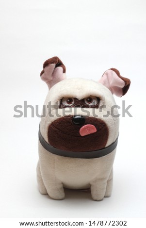 children's toy in the form of a dog on a white background