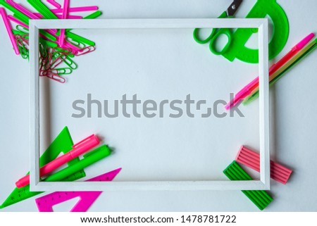 Back to school concept. School supplies on a white background, frame, copy space, top view