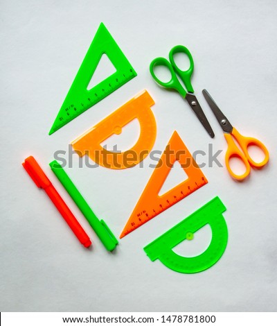 Starting school, back to school, education are styled flat lay scene with school supplies on white background. Square