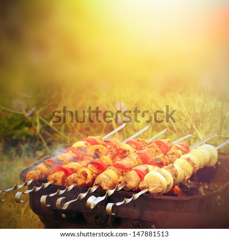 Beef and pork barbecue or kebab on the metal sticks  Royalty-Free Stock Photo #147881513
