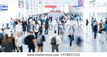 blurred business people in a modern corridor