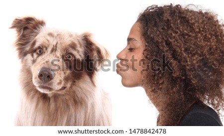 Portrait of a beautiful woman loving her dog