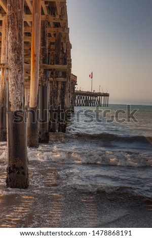 Underneath the Ventura Pier with the waves crashing