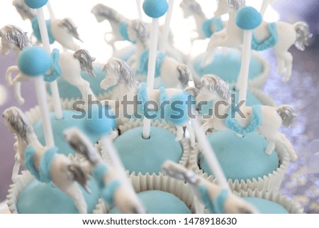 carousel cupcake with blue fondant
