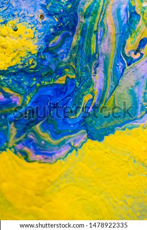 Acrylic liquid abstract pattern made with fluid art technique. 
Mix of yellow and blue acrilic color stains.  Сolorful artistic background Royalty-Free Stock Photo #1478922335
