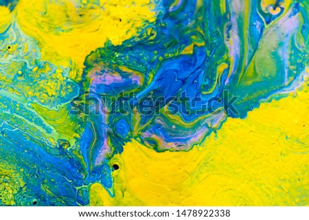 Acrylic liquid abstract pattern made with fluid art technique. 
Mix of yellow and blue acrilic color stains.  Сolorful artistic background Royalty-Free Stock Photo #1478922338