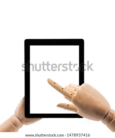 hand of wood doll make fingers to touch with Tablet on white background