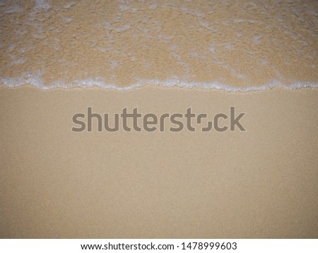 Sea with wave foam on beach