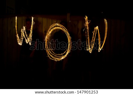 The word Wow in sparklers time lapse photography