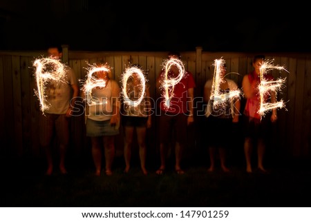 The word People in sparklers time lapse photography