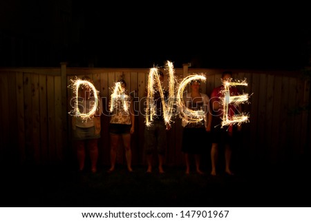 The word Dance in sparklers time lapse photography