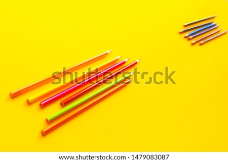 Color bright pencils on a yellow background.