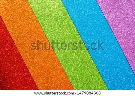 Abstract shiny colorful background. Red, orange, green, blue, purple glitter. A set of designer paper for decoration and design of Christmas, New Year or other holiday pictures. Beautiful packaging