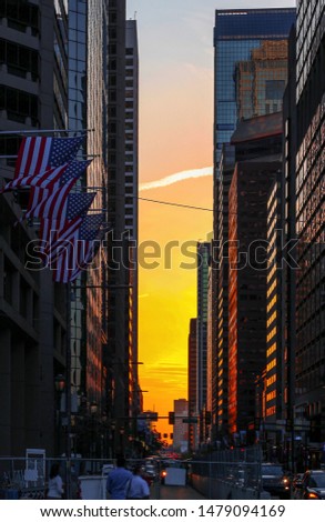 Beautiful sunset at Center City, Philadelphia, Pennsylvania.
Street View with traffic in the central business district near the historical City Hall.