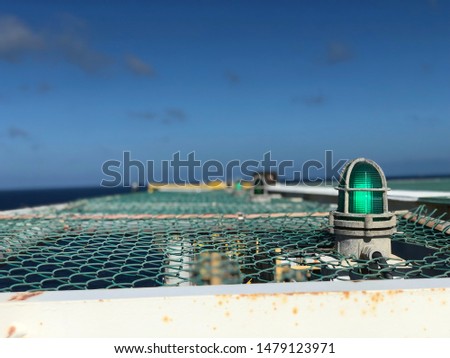 Offshore  signal lamp light or lighting on the starboard or port side of the living quarter.