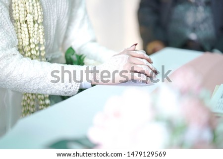 Close up of woman hand with full of white hena. 