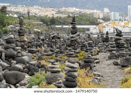 Pile of stones with city on background