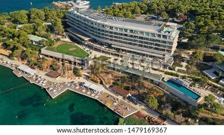 Aerial drone bird's eye photo of famous 5 star luxury Astir hotel and resort in iconic peninsula Vouliagmeni in south Athens riviera , Attica, Greece