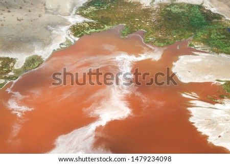 Aerial view of Lake Magadi Lake in the Great Rift Valley of Kenya. In the dry season the lake is 80% covered by soda and is known for its wading birds and huge flocks of lesser flamingos.