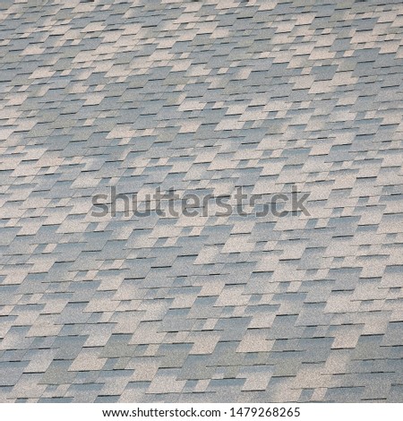 Background mosaic texture of flat roof tiles with bituminous coating