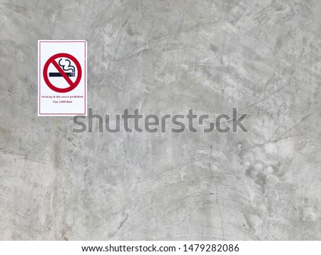 Label Smoking in this area.Non-smoking label and Polished cement wall