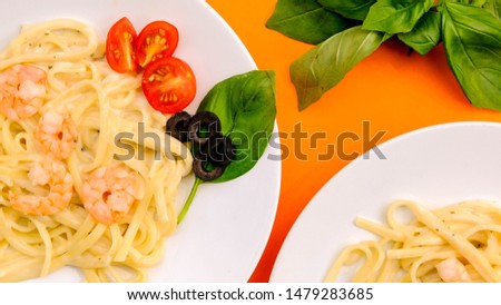 Italian Style King Prawn Alfredo Linguine Pasta In a Cheese Sauce With Basil and Black Olives