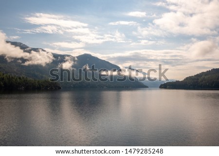 Cloudy, foggy mountains on the Telemark canal in Norway on a summer morning