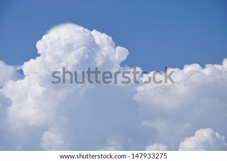 fluffy clouds in blue sky