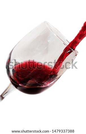 Red wine pours into long-stemmed glass (bocal). Advertising of wine products (good wine needs no bush) and drinking restaurants wine tasting. On white background