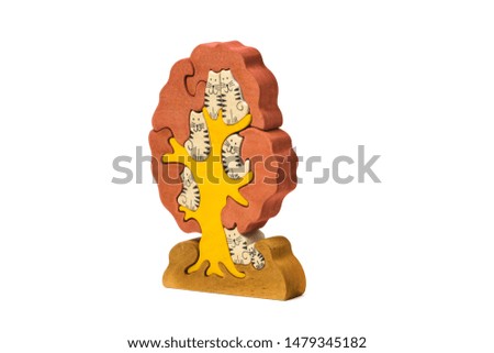 toy in the form of cats sitting on a tree isolated on a white background.