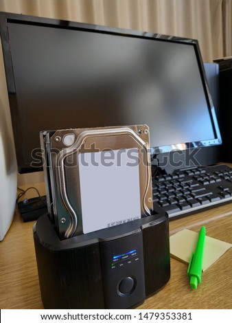 Close-up photo of hdd docking station at the office table while copying files from one external hdd hard drive to other