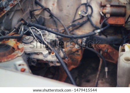 Close-up pictures of old cars, car bodies in the engine room, dust and soot, old car crash