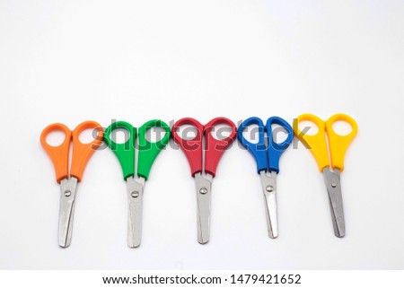 Colored school scissors in white background Royalty-Free Stock Photo #1479421652