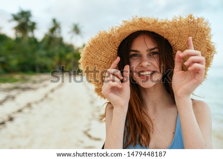  woman in hat happy at sea nature                              