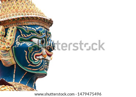Face of  the sculpture giant statue of a famous at The Emerald Buddha Temple and the Grand Palace, Bangkok, Thailand.