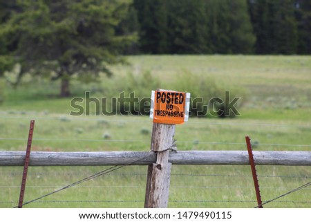 no trespassing on a sign post