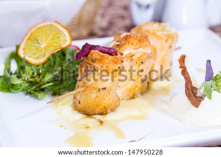 baked salmon rolls on a table in a restaurant
