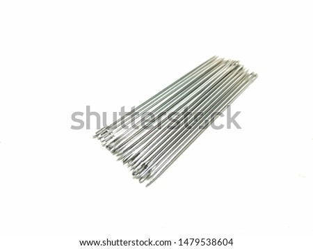A picture of small needles on a white background