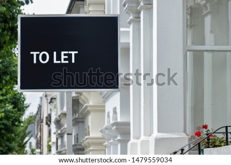 An estate agency 'To Let' sign board