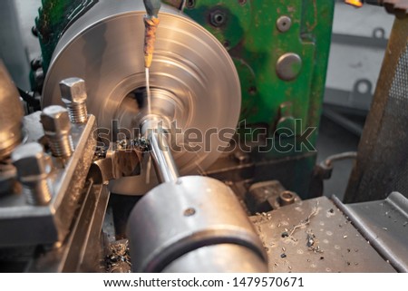 The manufacture of metal parts on a lathe, water-cooled.
