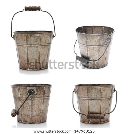 Collage of four views of an old fashioned metal bucket. Isolated on white with reflection. Royalty-Free Stock Photo #147960125