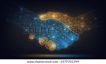 Two wire-frame glowing hands, handshake, technology, business, trust concept Royalty-Free Stock Photo #1479701399
