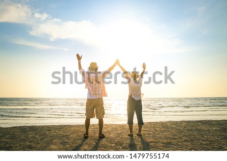 Elderly couples travel to the sea to relax in retirement Good health. Elderly society concept