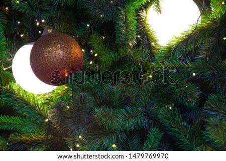 Illuminated  decoration of  Christmas tree with  hanging red ball. Flat layout for Christmas festival background concept.