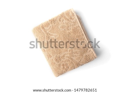 Three brown towel isolated on white background.