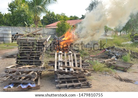 Burning fire or damaged wooden pallets