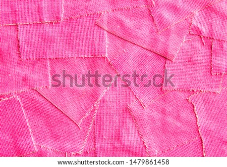Closeup torn pieces of  pink fluorescent cloth gaffer tape texture background.